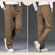 Brown pants displayed on a person with a visible brand logo.