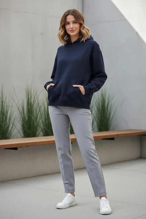 Navy blue hoodie worn by a person on a white background