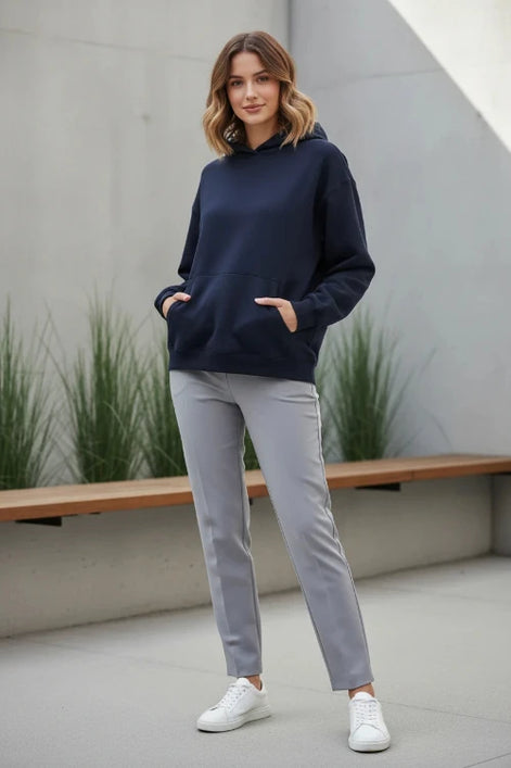 Navy blue hoodie worn by a person on a white background