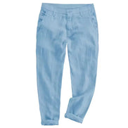 Light blue trousers with a relaxed, tapered fit and rolled cuffs, shown flat against a plain white background.