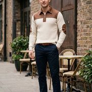 White sweater with brown accents on a white background