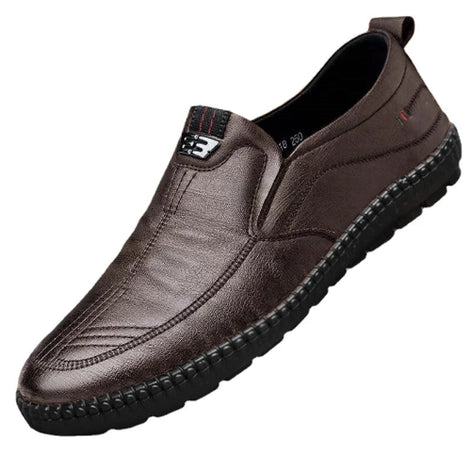 Brown leather slip-on shoe on a white background