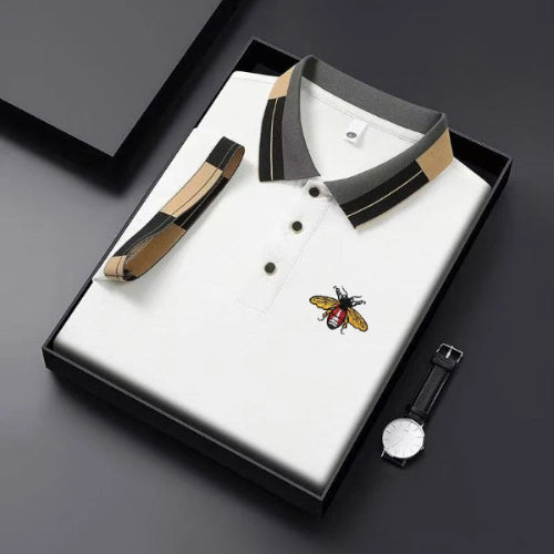 White polo shirt with black and brown accents in a box, featuring the brand 'BOOS'.
