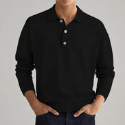 Person wearing a black long-sleeve shirt with a festive background featuring a Christmas tree and red truck.