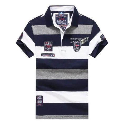 A short-sleeve polo shirt with horizontal navy blue, white, and heather gray stripes, featuring various embroidered and printed patches on the chest and sleeves.