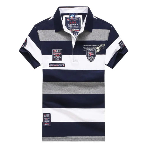 A short-sleeve polo shirt with horizontal navy blue, white, and heather gray stripes, featuring various embroidered and printed patches on the chest and sleeves.