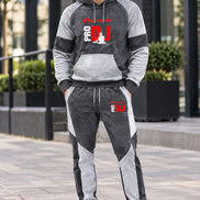 A two-piece athletic tracksuit set featuring a long-sleeve hoodie and matching jogger pants. 