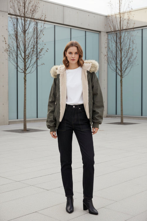 Green jacket with fur hood and trim worn by a model, brand 'ZAROY' visible.
