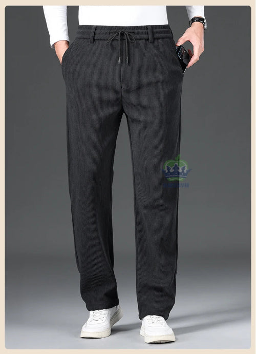 Black pants worn by a person on a gray background