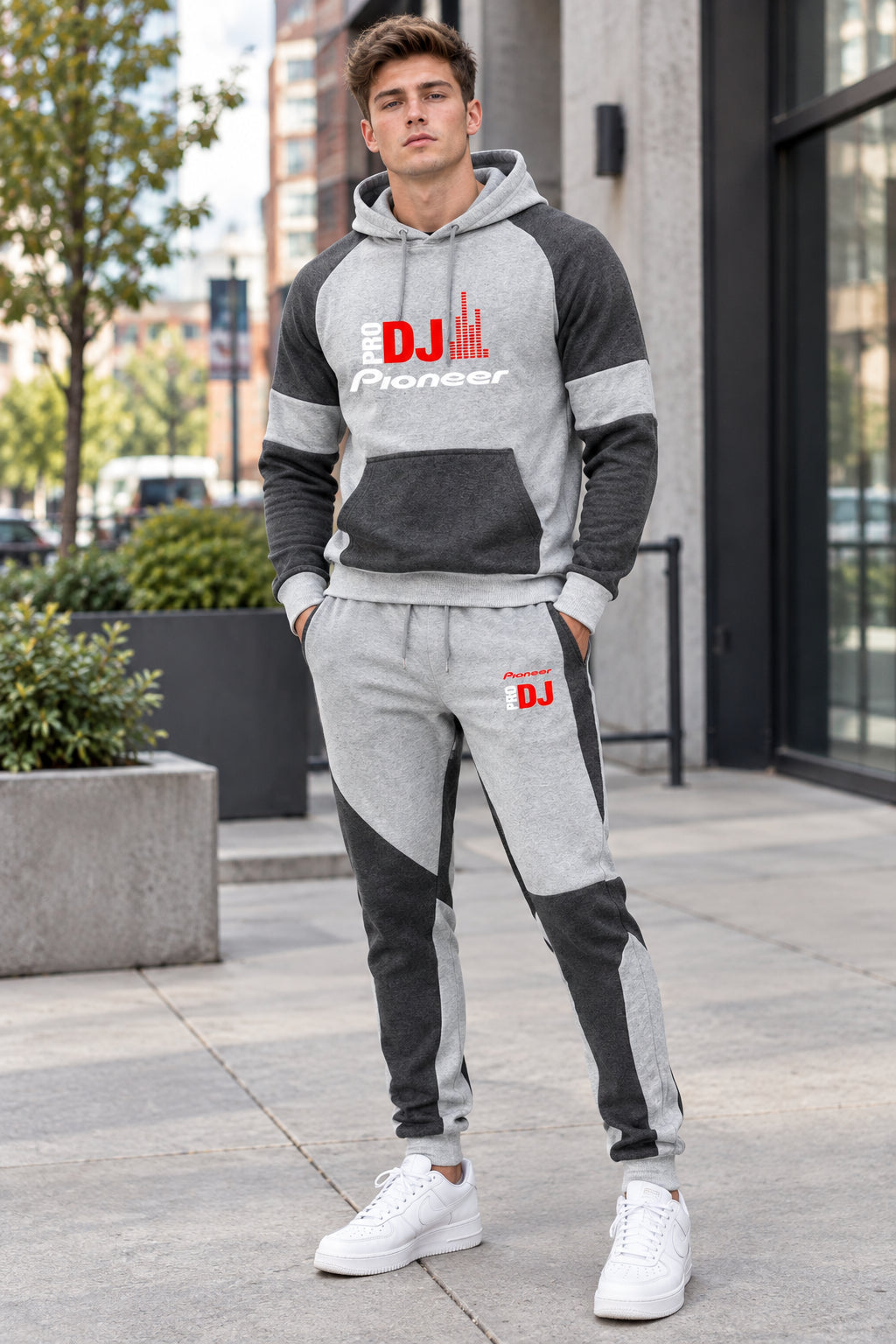 Gray and black hoodie and pants set with Motomorini logo on a white background