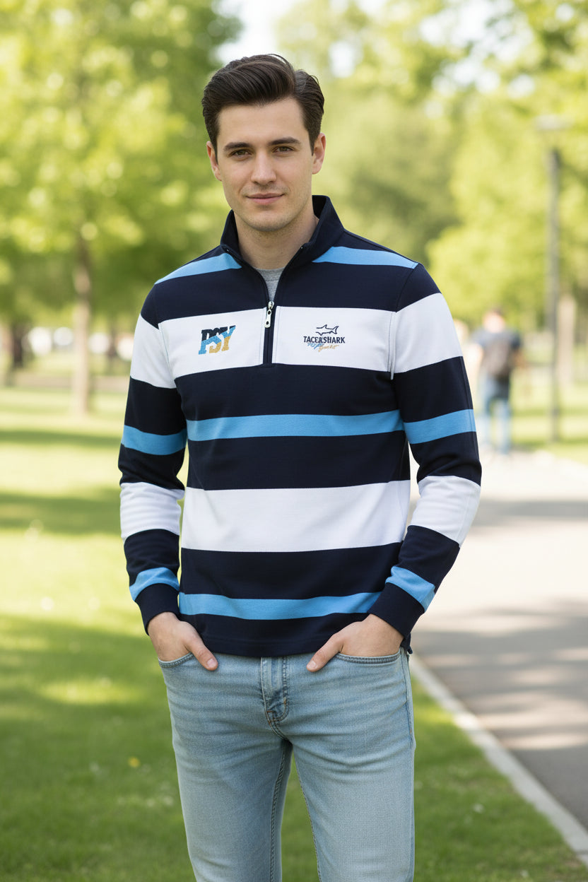 A men's long-sleeve quarter-zip rugby pullover with horizontal navy, white, and light blue stripes. The brand 'TACE&SHARK' is visible on the left chest and inside the collar.