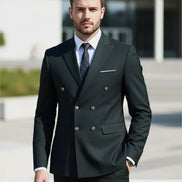 Dark gray suit with white shirt and patterned tie on a light gray background