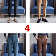 Four pairs of pants shown on a person sitting on a blue chair.