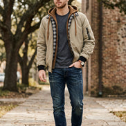 Beige jacket with plaid lining and brown accents on a white background