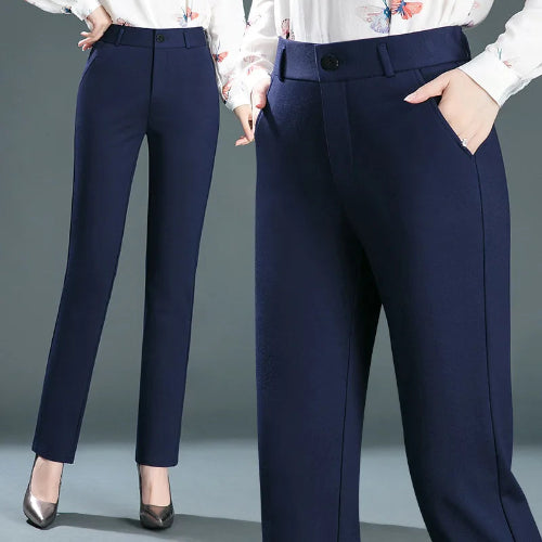 Navy blue pants worn by a person on a gray background