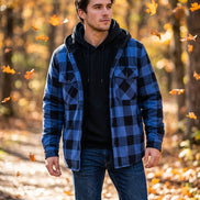 A blue and black plaid hooded jacket with a black fleece lining, shown on a white background with smaller color variants along the right side and a flame graphic with the word 'Warm' 