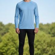 Man wearing a light blue long-sleeve shirt with TacVasen branding on a white background.