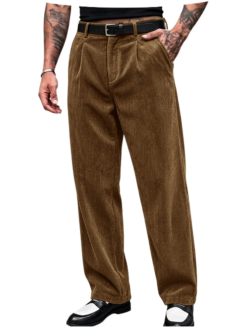 A person wearing brown corduroy trousers with a black belt, paired with black-and-white shoes, shown from the waist down on a plain white background.