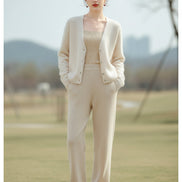 A woman wearing a fuzzy cream-colored cardigan sweater over a beige top, with a text overlay at the top reading 'COLOUR/米色'.