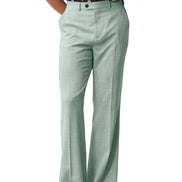 Green pants worn by a person on a white background