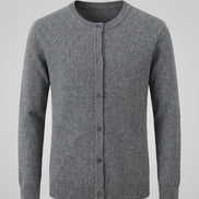 A gray knit cardigan sweater with a crew neck and button-front closure, hanging on a dark wooden hanger against a solid gray background.