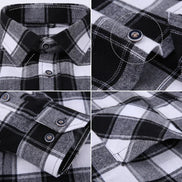 Close-up details of a black and white plaid shirt with buttons and collar.