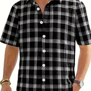 Black and white checkered shirt worn by a person on a white background