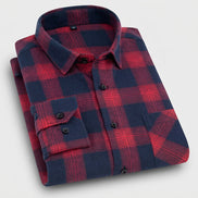 Folded red and blue plaid shirt on a white background