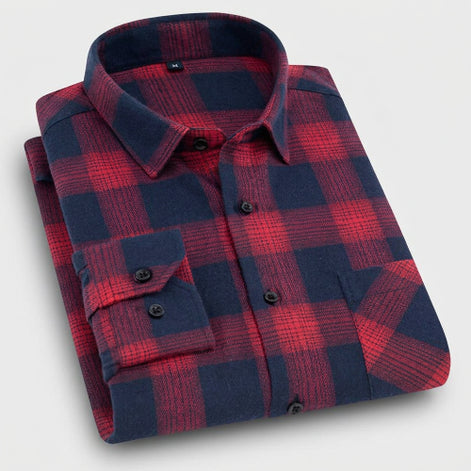 Folded red and blue plaid shirt on a white background