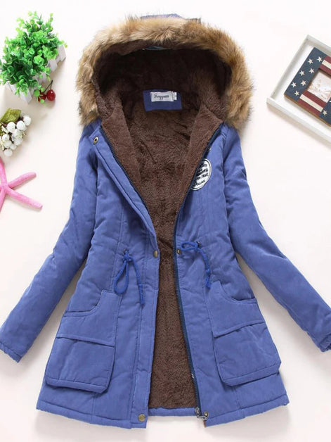 Blue winter coat with brown fur hood on a white background