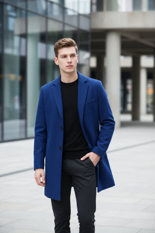 Blue coat on a mannequin against a gray background