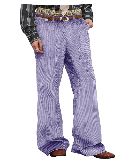 A person wearing loose, wide-leg lavender corduroy pants with a brown belt, a patterned shirt, and brown shoes, shown against a plain white background.