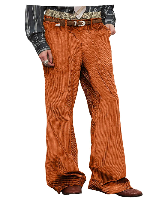 A person wearing wide-leg orange corduroy pants with a brown belt, a striped long-sleeve shirt, and brown shoes,