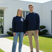 A navy blue crewneck sweatshirt with a small blue embroidered Dior logo on the left chest, displayed flat against a solid white background.
