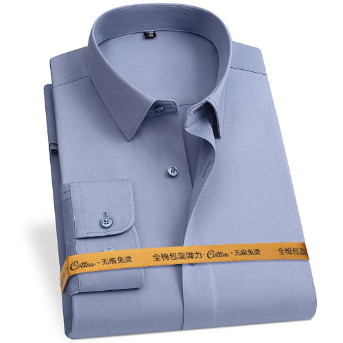 Folded light blue dress shirt with a yellow label on a white background