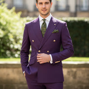 Teal suit with gold buttons on a mannequin and separate pants on a white background