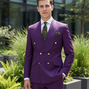 Gray suit jacket with gold buttons and matching pants on a white background