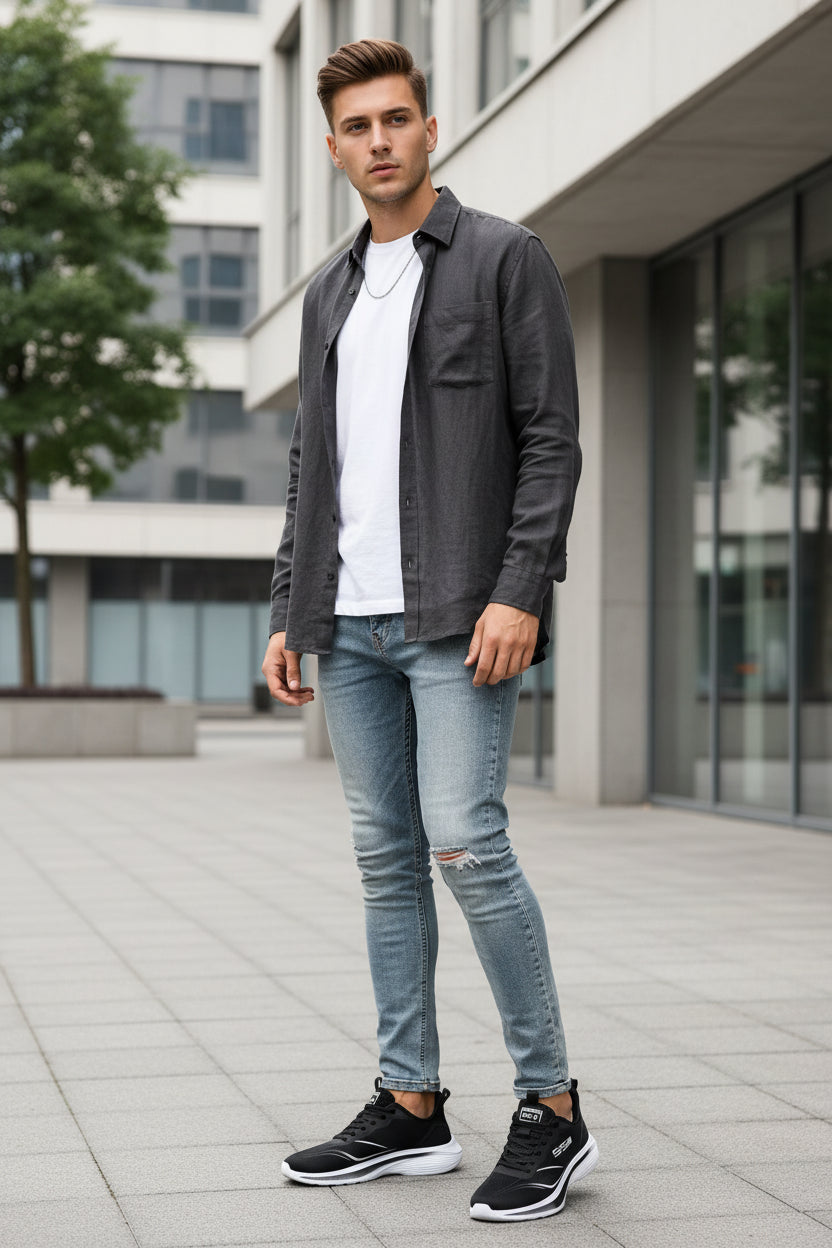Black running shoe with white sole Young man wering it outside