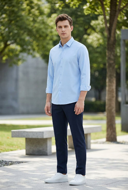 A light blue long-sleeve button-up shirt with a classic pointed collar, displayed on a clean white background.