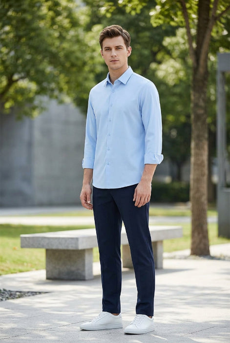 A light blue long-sleeve button-up shirt with a classic pointed collar, displayed on a clean white background.
