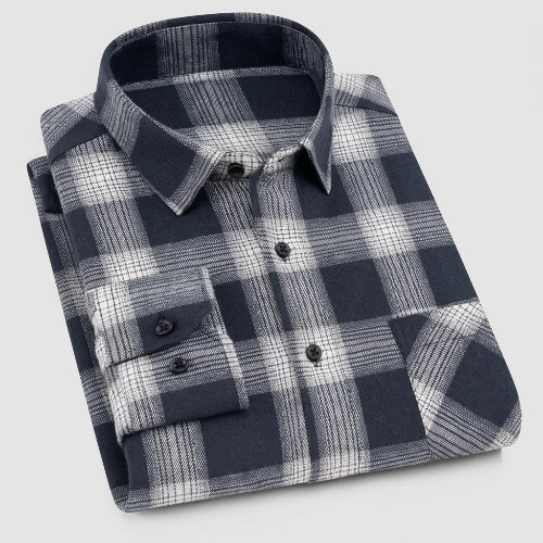 Folded black and gray plaid shirt on a white background with 'XDM21' label.