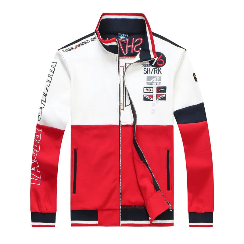 A color-blocked racing-inspired jacket with a white upper body, red lower body, and navy blue sleeve and collar accents, featuring various sponsor-style logos and text prints.