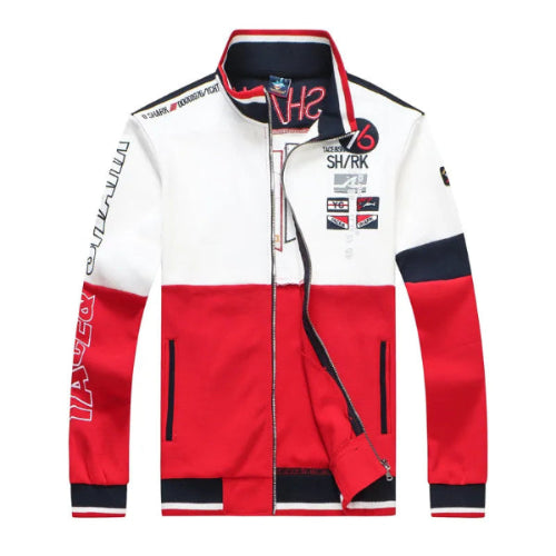 A color-blocked racing-inspired jacket with a white upper body, red lower body, and navy blue sleeve and collar accents, featuring various sponsor-style logos and text prints.