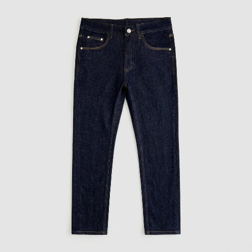 Dark indigo blue denim jeans laid flat on a white background, showing the front waistband, belt loops, button, pockets, and contrast stitching.