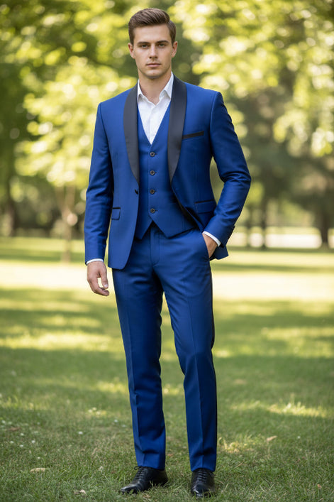 Man wearing a blue suit with black lapels on a gray background
