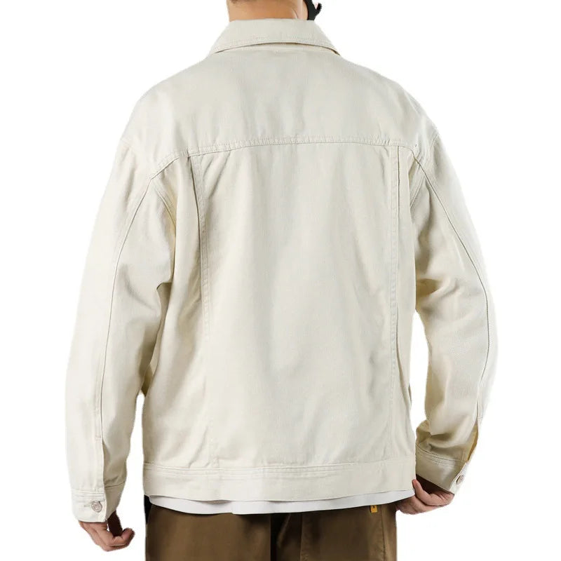 Beige jacket worn by a person on a white background