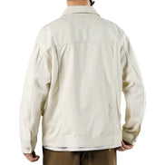 Beige jacket worn by a person on a white background