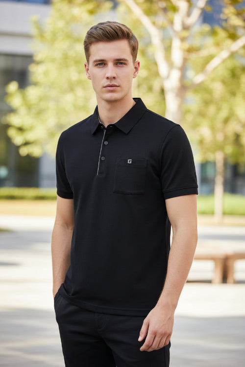 Navy blue polo shirt on a hanger with a hand touching it, brand logo visible