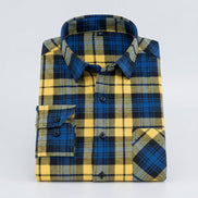 Folded blue and yellow plaid shirt on a white background