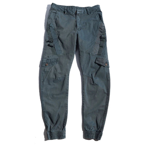 Gray cargo pants laid flat against a white background, showing angled thigh pockets, buttoned flap pockets, side straps, and gathered ankle cuffs.